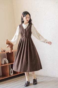 Basic corduroy pinafore dress in a midi length that can be layered with your favorite blouse or sweater. Buttons down the front and ties up at the waist. S: 33.5" chest and waist, 43" lengthM: 35" chest and waist, 43" lengthL: 36.5" chest and waist, 43.5" lengthXL: 38" chest and waist, 43.5" length Corduroy Pinafore, Corduroy Pinafore Dress, Corduroy Dress, Pinafore Dress, Overall Dress, Sweater Blouse, Cardigan Jacket, Autumn Summer, Cute Fashion