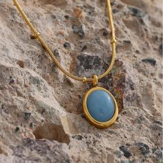 Gold Plated Brand New Hypoallergic Tarnish Resistant Elegant Light Blue Oval Necklaces, Blue Oval Link Necklace For Gift, Blue Oval Link Necklaces For Gift, Blue Oval Gemstone Necklace, Blue Gemstone Necklace With Oval Cabochon, 14k Gold Gemstone Oval Pendant Necklace, Light Blue Oval Gemstone Necklaces, Spiritual Gold Necklace With Patina, Elegant Blue Oval Cabochon Necklace