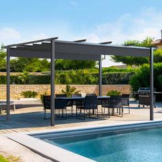 an outdoor dining area next to a swimming pool