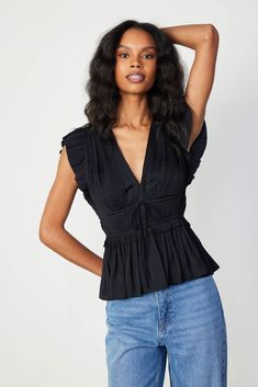 Add depth and dimension to your outfits with this plunging V-neck top. Accented by fluttery cap sleeves, the micropleated bodice features tie detailing and a comfortable cinched waist before flaring out to a ruffled peplum. •V-neckline •Pleated cap sleeves •Tie detail at front •Elasticized waist •Ruffled peplum Item number 2430072 50%RECYCLE POLY 50%POLY Gentle Cycle Cold Blue Floral Sundress, Peplum Shirts, Floral Sundress, Peplum Blouse, Sweater Sale, Spring 2024, Blouse Black, Pant Shirt, Trending Dresses