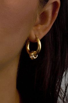 Our most loved and iconic 18K Gold vermeil hoops, the Parker earrings blend moments of chic and boldness. Enhanced with 18K gold vermeil accent pieces inlaid with white zirconia stones, their high polish shine and hints of sparkle give the perfect balance of contemporary minimalism and luxury. Materials: 18K Gold VermeilStone: Sixteen 1 millimeter Round Cut White ZirconiaDimensions: 20mm hoop, 4mm width What is 18K Gold Vermeil?: 3 microns of 18K Gold over Sterling Silver. Vermeil is far more du Luxury Materials, Accent Pieces, Gold Vermeil, Round Cut, Gold Jewelry, 18k Gold, Hoop Earrings, Sparkle, Sterling Silver