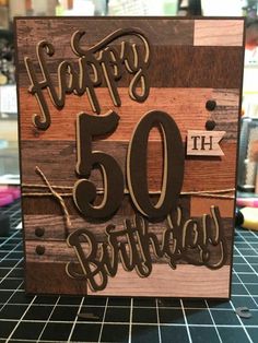 a wooden birthday card with the number fifty on it