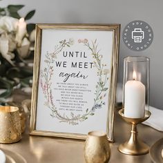 a table with candles, flowers and a framed sign that says until we meet again