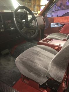 the interior of an old car with leather seats