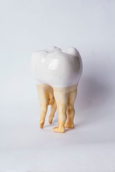 a toothbrush holder made to look like it is standing on its hind legs and teeth