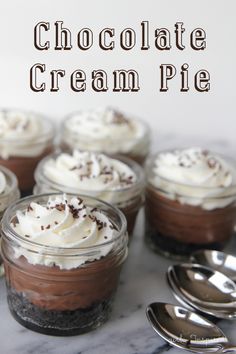 chocolate cream pies in small glass jars with spoons on the side and text overlay that reads chocolate cream pie