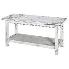 an old white coffee table with wooden shelves