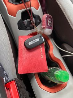 a cell phone and car keychain in the back seat