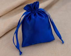 Set of 100 Blue satin drawstring pouches equipped with ribbon strings for the easy closure. The mesmerizing shine of satin fabric is enough to draw attention and makes them a perfect accessory to carry in events. You can stamp your brand or personalized logo with greeting to enhance the look of these beautiful pouches. These pouches are perfect for gift packaging and storing precious stones, Wedding Favors, Baby Showers, Gift Packaging and many more. We offer Free shipping worldwide all our orde Blue Packaging, Packaging Pouch, Etsy Wedding Favors, Packaging Bag, Logo Gifts, Wedding Favor Bags, Personalized Logo, Metallic Prints, Drawstring Pouch