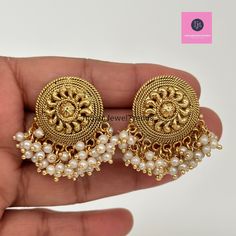 Antique Pearl Gold Studs Earrings /Indian Studs/Indian Earrings/Indian Jewelry/Pearl Stud/Bridal Jewelry/Indian wedding/South Indian Jewelry Style 1 Height = 38 Mm || Width = 30 Mm Style 2 Height = 35 Mm || Width = 34 Mm Style 3 Height = 32 mm || Width = 34 mm Style 4 Height = 32 mm || Width = 34 mm This is 100% Handmade jewelry. So Color, shades, texture displayed may slightly vary from the actual product due to digital image limitations. We request you to consider these minor variations. Please expect the possibility of some slight imperfections when buying handmade jewelry. If you have any questions, please message or email us. Arrives in a gift box. Please let me know if you have any questions. Thank you so much for visiting my shop. Pearl Chain Chandbali Earrings For Celebrations, Chandbali Pearl Chain Earrings For Celebration, Traditional Pearl Chain Earrings For Celebration, Temple Jewelry Style Earrings With Pearl Chain, Pearl Chain Chandbali Temple Earrings, Temple Jewelry Style Earrings With Pearl Chain For Gift, Traditional Pearl Chain Earrings For Wedding, Temple Jewelry Chandbali Earrings With Pearl Chain, Temple Jewelry Earrings With Pearl Chain For Festivals