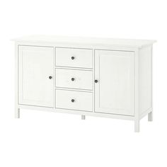 a white cabinet with four drawers and two doors