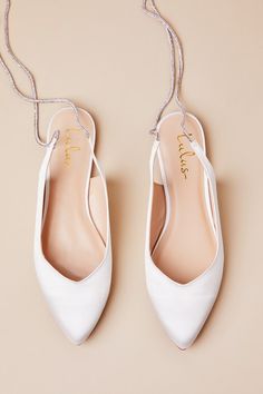 You can strut down the aisle or dance the night away in effortless style and comfort, thanks to the Lulus Finnian White Satin Rhinestone Lace-Up Pointed-Toe Flats! Luxe woven satin shapes these diva-approved flats that feature a classic pointed-toe upper and a low-cut collar that continues into long, rhinestone-embellished laces that wrap and tie above the ankle. 0. 25" rubber heel. Lightly cushioned insole. Felted rubber sole has nonskid markings. Man made materials. Imported. Lulus | Finnian W Wedding Shoes Bride Flats, Bride Flats, Sparkly Flats, Shoes Bride, Sparkly Shoes, Sparkly Wedding, Wedding Shoes Bride, Pointed Toe Flats, Fall Shoes