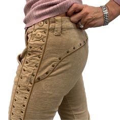 a person with their hand on the back of his pants, showing how to wear them