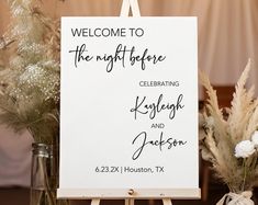 a welcome sign sitting on top of a wooden easel