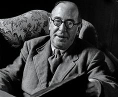 black and white photograph of a man reading a book