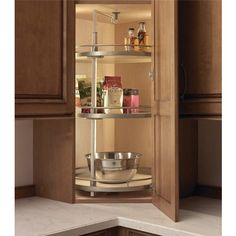 an open cabinet in the corner of a kitchen