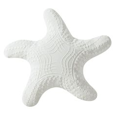 a white ceramic starfish on a white background