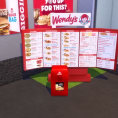 a menu stand with a red box on it in front of a wall that says wendy's