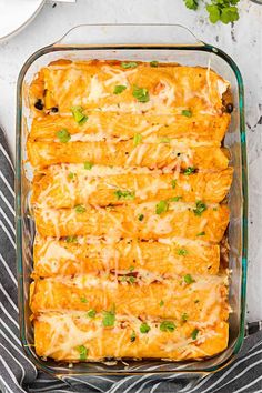 an enchilada casserole in a glass baking dish