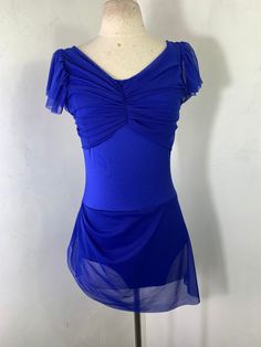 a woman's blue dress on a mannequin