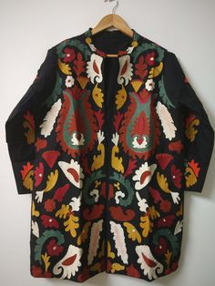 "Ethnic Boho Jacket, Unique Embroidery Long Coat, Black Embroidery Coat, Indian Ladies open Jacket  Handmade Overcoat, Women Winter Jacket,  This stylish Embroidery Jacket crafted from a comfortable fabric, this eye-catching piece is perfect for any occasion. Its unique design features intricate details and embroidered patterns that are sure to make a statement. Easy to Carry, You Can Wear It on Your Party Attire, Daily Wear, You Can Use This as Beachwear, Lounge wear and as a Regular Outfit, This One Product Will Be Suitable for your Multiple Occasions. Wear it with any black and white dress, or with jeans to add color and beauty. Handmade in India. Size:-One size (plus) US women's letter Measurements: Length: 32\" Inches Bust : 44\" Inches Sleeve : 20\" Inches Color : Same As Picture Fab Fall Outerwear With Multicolor Resham Embroidery, Traditional Fall Outerwear With Motifs, Traditional Multicolor Outerwear With Traditional Patterns, Folk Style Black Outerwear For Fall, Black Folk Style Outerwear For Fall, Folk Style Black Outerwear For Festivals, Black Folk Style Outerwear For Festivals, Folk Style Outerwear With Resham Embroidery For Festivals, Black Folk Outerwear For Festivals