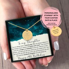 a woman's hand holding a personalized necklace with your custom date and place