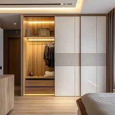 a bedroom with a bed and closets in it's walls, lights on the ceiling