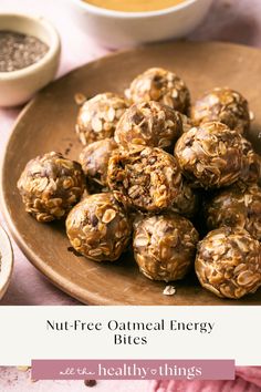 a plate full of nut - free oatmeal energy bites on a table