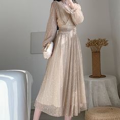 Shimmery nude gold midi dress with twinkly holographic silver stars and moons all over. Faux wrap v-neckline and back with a cinched waist and long puff sleeves. Concealed back zipper. Lined. S: 33" chest, 25" waist, 46" length M: 34.5" chest, 26.5" waist, 46.5" length L: 36" chest, 28" waist, 47" length XL: 37.5" chest, 29.5" waist, 47.5" length Gold Midi Dress, Stars And Moons, Long Sleeve Casual Dress, Long Puff Sleeves, French Design, Cinched Waist, Silver Stars, Stars And Moon, Puff Sleeves