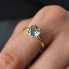 D E T A I L S - Material: 925 Sterling SilverStone: Blue Topaz Stone Shape:- Round Stone Size:- 8mmThe Fit: True to US ring size Finish: Smooth and Gold PlatedS H I P P I N G & P R O D U C T I O N - My current production time is 2-6 business days, which means after those days are up, your order ships! I make everything custom to order, by hand, but I promise you it's worth the wait!R U S H - M Y - O R D E R -If you're in a rush to get your pretty new pieces, please send me a message and I'll Topaz Birthstone Promise Ring In Fine Jewelry Style, Fine Jewelry Topaz Birthstone Promise Ring, Topaz Birthstone Promise Ring Fine Jewelry, Promise Jewelry With Topaz Birthstone, Topaz Crystal Promise Ring, Topaz Birthstone Ring Jewelry, Classic Topaz Birthstone Ring For Gift, Yellow Gold Topaz Birthstone Ring For Gift, Yellow Gold Topaz Birthstone Ring As Gift