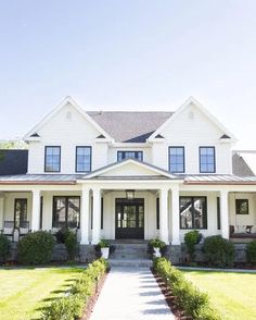 a large white house with lots of windows