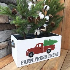 a wooden box with a christmas tree in it