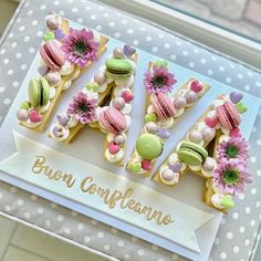 the word cake spelled out with decorated cookies