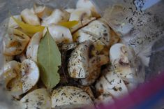 mushrooms and herbs in a blender with some green leaves on the top of it