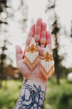 Cream Round Beads Earrings As A Gift, Cream Beaded Round Earrings, Bohemian Cream Jewelry With Ear Wire, Artisan White Earrings With Tiny Beads, Artisan White Beaded Earrings With Tiny Beads, Handmade Bohemian Cream Earrings, Cream Bohemian Earrings As A Gift, Cream Bohemian Earrings As Gift, Handmade Cream Bohemian Earrings