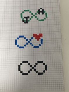 an image of some type of pixel font on a sheet of graph paper with scissors