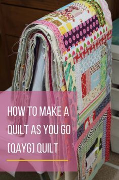 a quilt on top of a chair with the words how to make a quilt as you go qaygi quilt