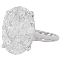 This breathtaking solitaire ring features a stunning 11.20 carat oval diamond, certified by the Gemological Institute of America (GIA). Set in a sophisticated platinum band, this ring exudes timeless elegance and luxury, making it an exceptional piece of jewelry for any occasion. The oval diamond boasts a color grade of H, placing it in the near-colorless category and ensuring a bright, pristine appearance that radiates brilliance. Its clarity grade of VS2 signifies very slight inclusions that are difficult to detect even under magnification, allowing the diamond's natural beauty to shine through with remarkable clarity. Both the polish and symmetry of the diamond are rated as Excellent, reflecting superior craftsmanship and precision, resulting in a flawlessly smooth surface and perfectly Most Expensive Diamond Ring, Golconda Diamond, Oval Solitaire Ring, Oval Diamond Ring, Solitaire Rings, Beautiful Diamond Rings, Contemporary Ring, Expensive Jewelry, Modern Ring