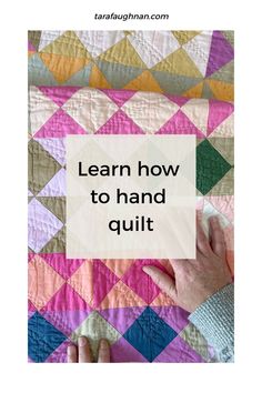 someone is holding up a quilt with the words learn how to hand quilt