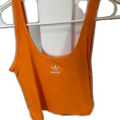 Basic Spring Sports Crop Top, Basic Crop Top For Sports In Spring, Orange Casual Tank Top For Sports, Basic Spring Crop Top For Sports, Casual Orange Tank Top For Sports, Adidas Cotton Tank Top For Spring, Adidas Fitted Summer Tops, Adidas Casual Summer Tank Top, Casual Adidas Summer Tank Top