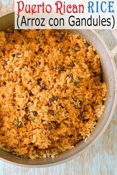 a pot filled with rice and raisins on top of a blue tablecloth