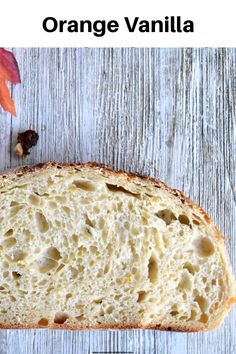 a loaf of orange vanilla bread sitting on top of a wooden table