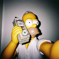 a person in a white shirt holding money and a cell phone with the simpsons character on it