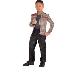 a young boy wearing a star wars costume and standing with his hands on his hips