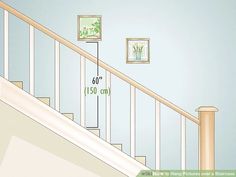 a stair case with measurements on the wall above it and pictures hanging on the wall