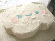 a frosted cake sitting on top of a pan