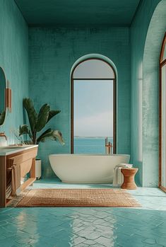 a bath room with a large tub and a sink under a window next to the ocean