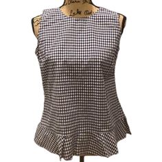 Really Pretty Spring/Summer Top From Tommy Hilfiger! This Lovely Top Is Done In Navy And White Cotton Gingham. Styled As A Sleeveless Top It Has A Ruffled Hem With Side Slits And Has A Back Zip. Sized A S It Has A 19” Underarm To Underarm And 24” Length. Brand New With Tag Attached! Bin 7k Fitted Summer Blouse With Ruffle Hem, Summer Workwear Peplum Blouse, Chic Summer Peplum Blouse, Fitted Peplum Top With Ruffle Hem For Summer, Sleeveless Cotton Tank Top With Ruffle Hem, Cotton Sleeveless Tank Top With Ruffle Hem, Cotton Ruffle Hem Sleeveless Tank Top, Summer Sleeveless Tank Top With Ruffle Hem, Fitted Ruffle Hem Tank Top For Summer