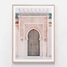 a framed photograph of an ornate doorway