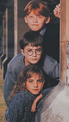 three young boys are posing for a photo